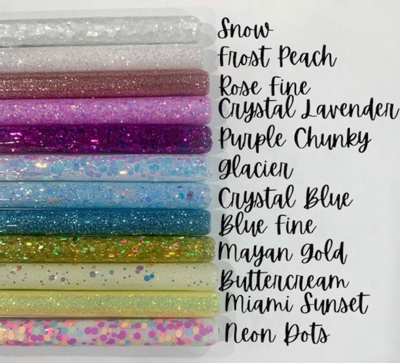 May include: A collection of 12 glitter tubes in various colors, including snow, frost peach, rose fine, crystal lavender, purple chunky, glacier, crystal blue, blue fine, Mayan gold, buttercream, Miami sunset, and neon dots.