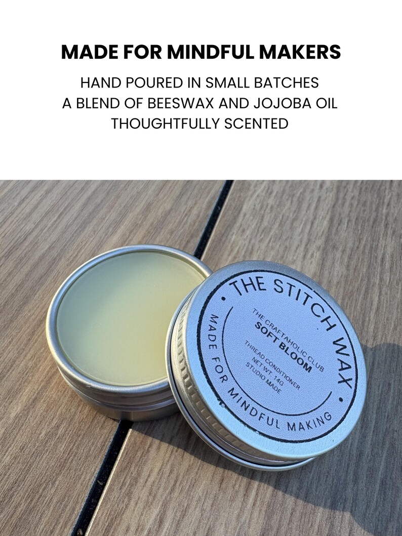 May include: A round silver metal tin containing light yellow thread conditioner wax. The lid is labeled THE STITCH WAX, THE CRAFTAHOLIC CLUB SOFT BLOOM, THREAD CONDITIONER, NET WT. 14G, STUDIO MADE, MADE FOR MINDFUL MAKING. Text above reads MADE FOR MINDFUL MAKERS.