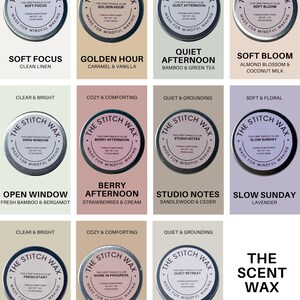 May include: A collection of eleven round tins of The Stitch Wax thread conditioner, each featuring a unique scent name and description. The labels include Soft Focus, Golden Hour, Quiet Afternoon, Soft Bloom, Open Window, Berry Afternoon, Studio Notes, Slow Sunday, Fresh Start, Work in Progress, and Quiet Retreat, with the text The Scent Wax Scent Library.