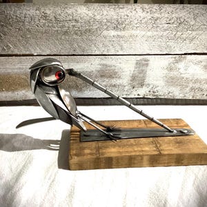cutlery Robin pulling a worm.
