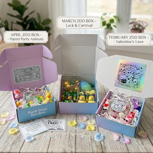 May include: A set of three ceramic mugs with a speckled, matte finish. The mugs are in shades of cream, light gray, and dark gray. Each mug has a simple, minimalist design, perfect for coffee or tea.