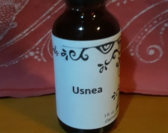 May include: A small brown glass bottle with a black dropper top. The bottle is labeled "Usnea" and contains 1 fl. oz. of liquid.