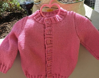 Hand-knitted baby girl vest