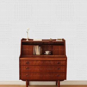 May include: A vintage wooden desk with a drop-down front and three drawers. The desk has a small shelf above the drop-down front and a small white vase with a single white flower on the shelf. There is a small white teacup and saucer on the desk.