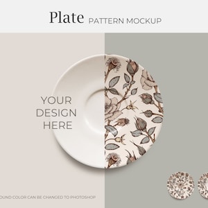 May include: A white ceramic plate with a floral pattern of brown roses and green leaves. The plate is on a light brown background. The text "YOUR DESIGN HERE" is on the plate.