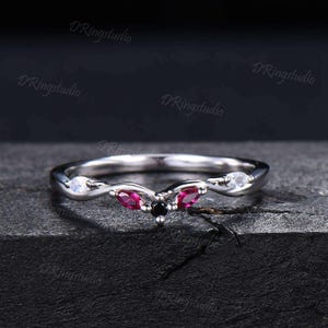 May include: A set of three ceramic mugs with a speckled, matte finish. The mugs are in shades of cream, light gray, and dark gray. Each mug has a simple, minimalist design, perfect for coffee or tea.