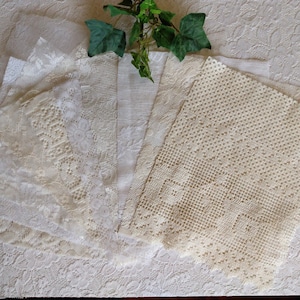 May include: A collection of ten white lace fabric scraps, some with intricate patterns, arranged on a white textured surface.