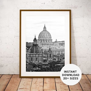 May include: Black and white photograph of the Rome, Italy skyline, featuring the dome of St. Peter's Basilica.