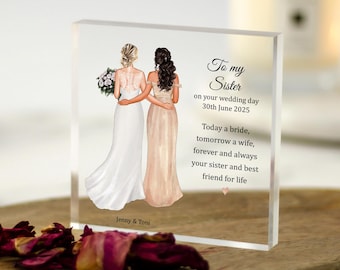 May include: A white acrylic block with a hand-drawn illustration of two brides in wedding dresses. The text reads "To my Sister on your wedding day 30th June 2025 Today a bride, tomorrow a wife, forever and always your sister and best friend for life".