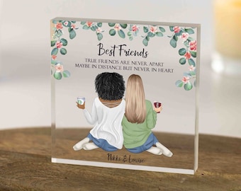 May include: A clear acrylic block featuring an illustration of two friends sitting together, holding coffee cups. The block is adorned with floral accents and the text "Best Friends: True friends are never apart, maybe in distance but never in heart." The names "Nikki & Louise" are at the bottom.