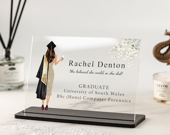 May include: A clear acrylic plaque with a black base, featuring a graduate in a black cap and gown, holding a diploma. The text reads "Rachel Denton, She believed she could, so she did! Graduate, University of South Wales, BSc (Hons) Computer Forensics".