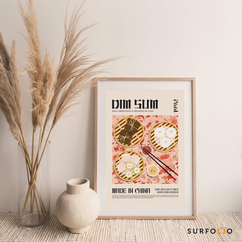 May include: A poster with a pink background and a graphic illustration of dim sum dishes. The poster has the text "Dim Sum" in black and white, "Made in China" in black and white, and "308 Jian Guo Men 10004 Shanghai" in black and white. The poster also has the year "1992" in black and white.