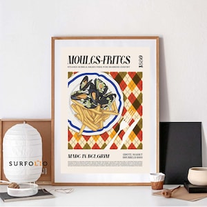 May include: A framed art print featuring a plate of mussels and fries, a classic Belgian dish. The artwork includes the text "MOULES-FRITES" and "MADE IN BELGIUM" with a decorative argyle pattern in the background. The print is in a wooden frame.