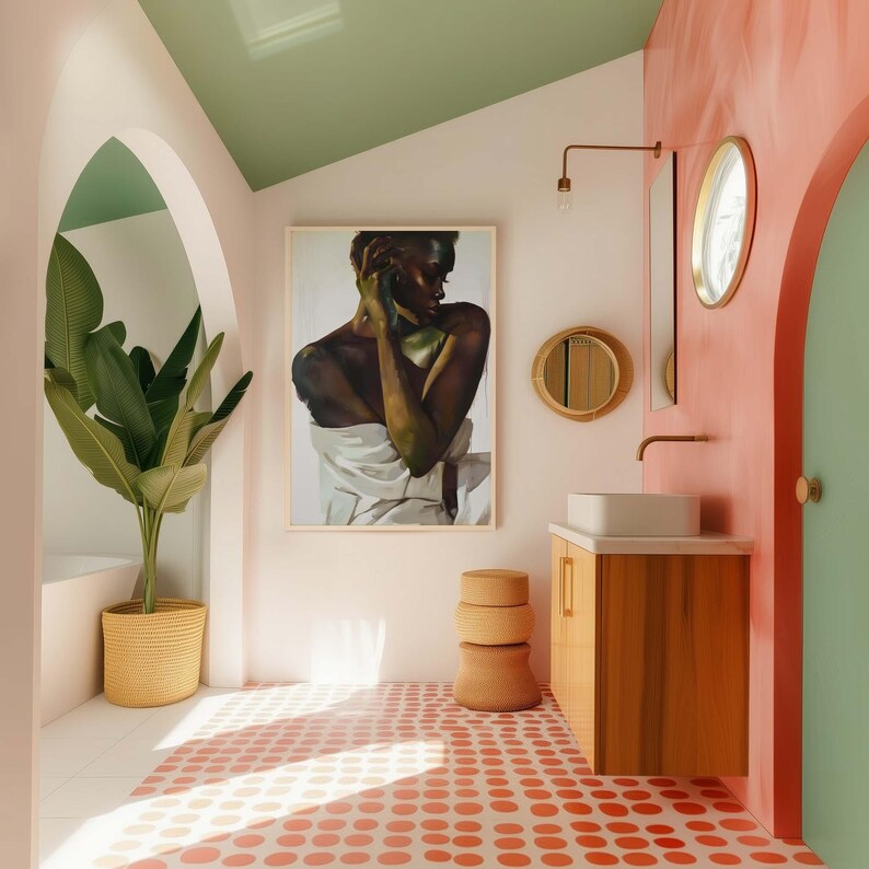 May include: A modern bathroom interior with a painting, a wooden vanity, and a round mirror. The floor features a pattern of red circles on a white background. A large potted plant and a stack of woven stools add to the decor.