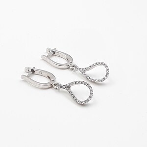 Drop earrings set with diamonds, 14k white gold.