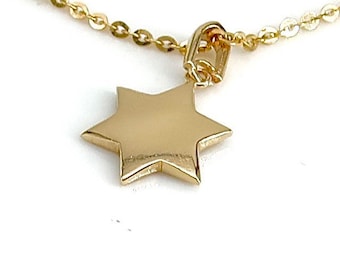 May include: A gold chain necklace with a star of David pendant.