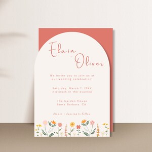 May include: Wedding invitation with a peach background and a white arch. The invitation reads "Elain Oliver" and includes the wedding date, time, location, and the phrase "dinner - dancing to follow".