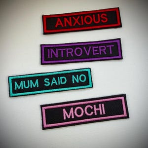 May include: A trio of ceramic mugs with a speckled, matte finish in cream, light grey, and dark grey. Each mug has a simple, modern design and a rounded handle. Ideal for tea or coffee.