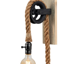 May include: A rustic wall sconce with a black metal pulley and a natural rope cord. The sconce has a wooden base and a single light bulb.