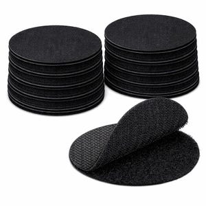 Peut inclure: Ronds noirs auto-agrippants. L'image montre des piles de coussinets, avec une paire ouverte pour afficher les surfaces auto-agrippantes. Les coussinets sont faits d'un matériau texturé.