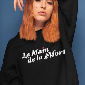 Un sweatshirt éducatif mortel | La Main de la Mort | Le ras du cou Scholomance | Le dernier diplômé | Merchandising livresques | Sweat-shirt unisexe