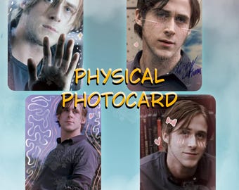 May include: A collection of four rectangular physical photocards featuring portraits of a man with brown hair. The images are decorated with digital overlays including pink hearts, cat ears, whiskers, and a bow. The text PHYSICAL PHOTOCARD is centered.
