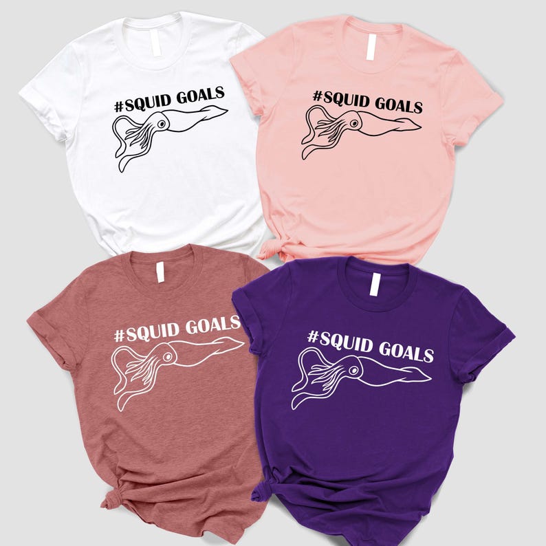 four t-shirts with the same design, featuring a squid graphic and the text "#SQUID GOALS" printed on them.