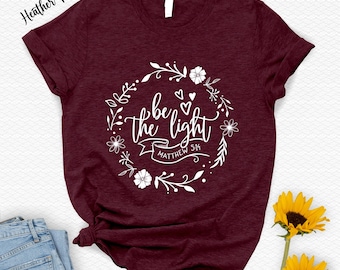Camiseta "Sé la luz": Prendas de vestir con versículos bíblicos cristianos