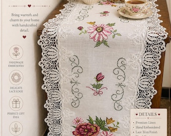 May include: A white linen table runner with hand-embroidered floral designs and a delicate lace edge. The runner features pink and red flowers, and the text "THE LINEN PETAL". Perfect for tables, dressers, and cabinets.