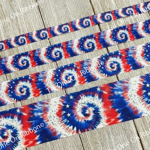 May include: Red, white, and blue tie dye ribbon with white stars. The ribbon is shown in four different widths.