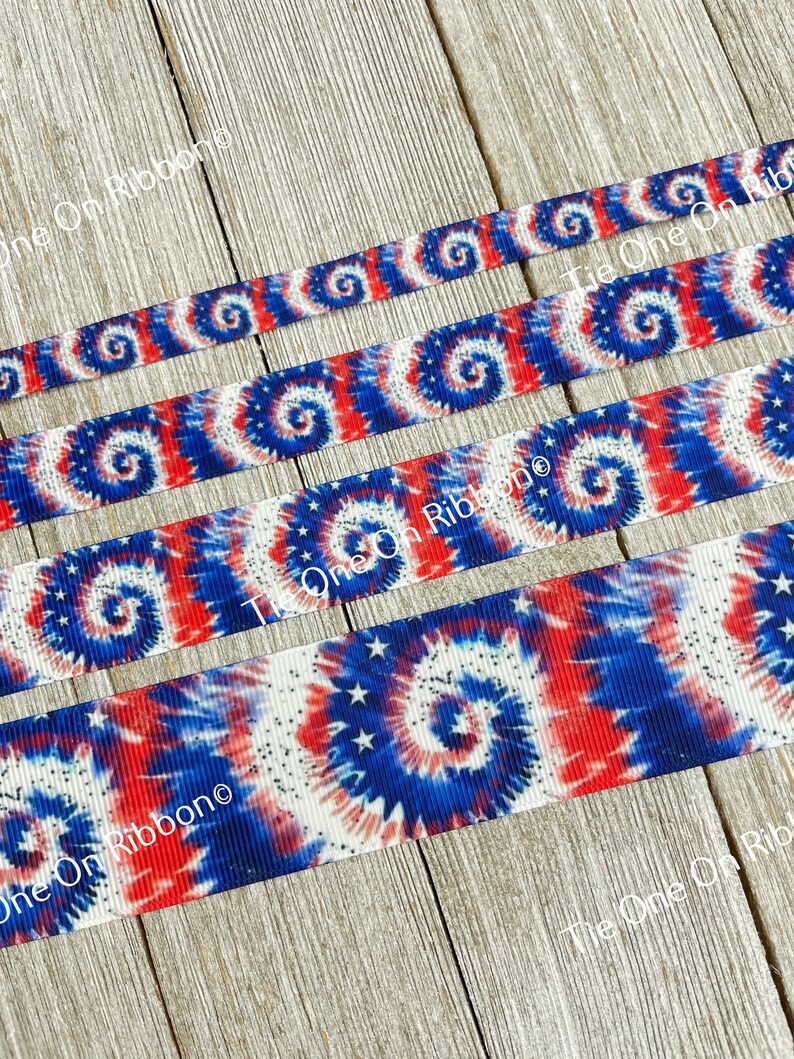 May include: Red, white, and blue tie dye ribbon with white stars. The ribbon is shown in four different widths.