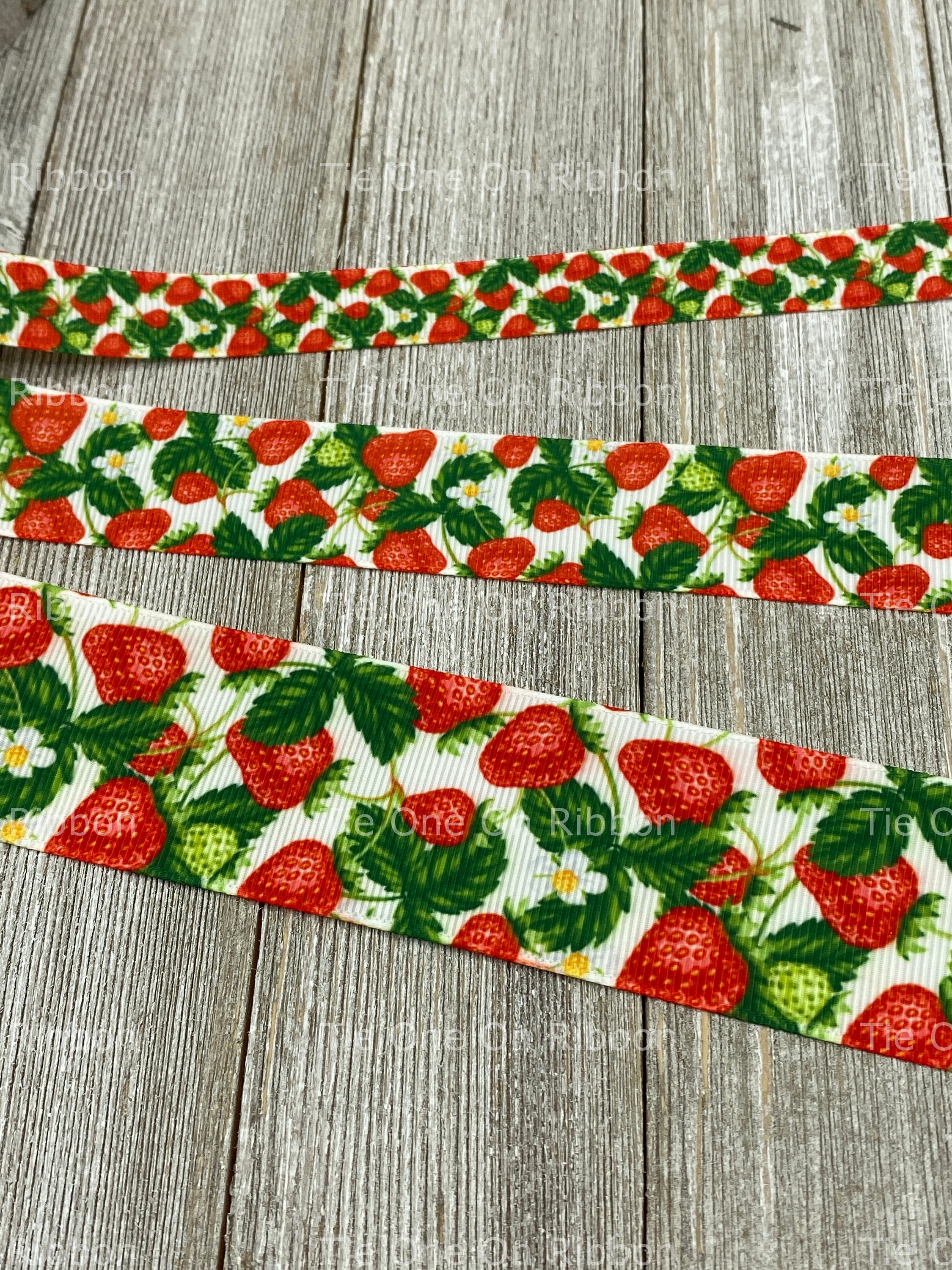 Strawberries Ribbon with white flowers on a blue background on 5/8