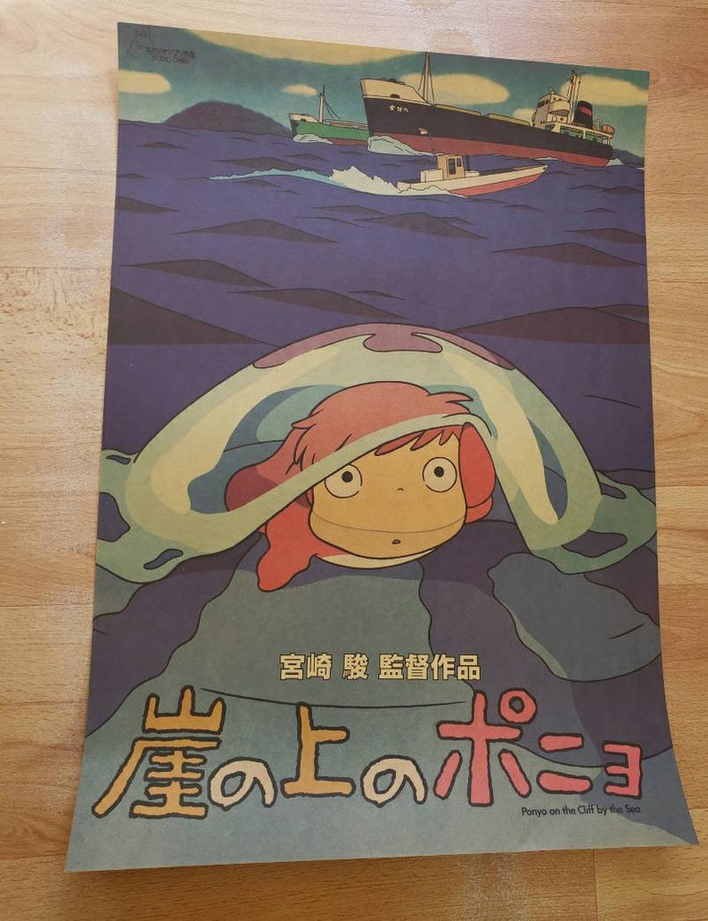 May include: A vintage-style poster for the animated film "Ponyo on the Cliff by the Sea". The poster features a young girl with pink hair, looking up from inside a large, translucent bubble. The background is a blue ocean with two ships in the distance. The title of the film is written in Japanese characters, with the English translation below.