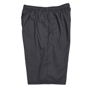 May include: A pair of dark gray athletic shorts with an elastic waistband.