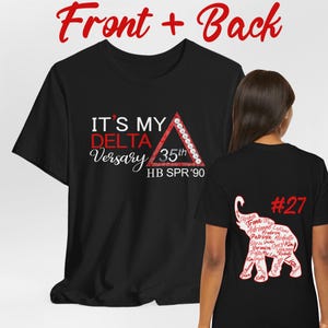 May include: Black t-shirt with the text "IT'S MY DELTA Versary 35th HB SPR '90" in red and white. The back of the shirt features a red elephant with names and the number 27 in red.