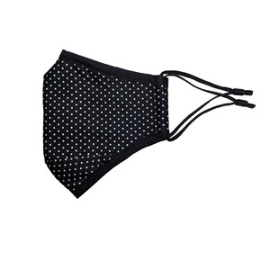 May include: Black face mask with white polka dots and adjustable ear loops.
