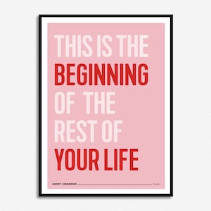 May include: A pink and white motivational poster with the text "This is the beginning of the rest of your life." The text is in a bold, sans-serif font. The poster is framed in black.