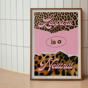 May include: A pink and brown poster with the text "Leopard is a Neutral" in a pink and brown font. The poster has a leopard print background.