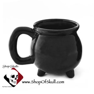 The black cauldron or kettle mug measures:
4 1/4 inches tall
3 1/4 inches in diameter (cup portion only)
Holds 16 ounces
finished with lead free cauldron black glaze 
Dishwasher safe
Made to Order
Shop at www.ShopOfSkulls.com for more amazing items.