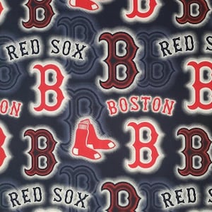 May include: Dark blue fabric featuring a repeating pattern of the Boston Red Sox logo, the letter "B", and the words "RED SOX" and "BOSTON" in white and red. The design also includes images of red socks.
