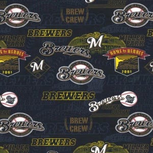 May include: Dark blue fabric featuring a repeating pattern of Milwaukee Brewers baseball team logos, text, and imagery. The design includes the team name, baseballs, and the words "Brew Crew" and "Miller Park".