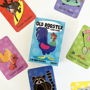 May include: A blue and green card game box with a rooster illustration. The box says "Old Rooster Card Game" and has the text "2 or more players" and "Ages 4+" on the bottom.