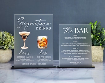 May include: Two rectangular frosted acrylic signs with white text. The left sign reads Signature Drinks, hers Espresso Martini, his Old Fashioned, and Sophie & David 10.09.2024. The right sign reads the BAR with lists of beer, wine, spirits, and non-alcoholic drinks.