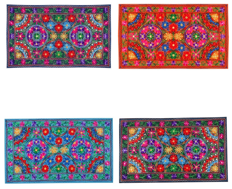 May include: Four colorful rectangular embroidered throw pillows with a floral pattern. The pillows have a dark blue, red, light blue, and dark blue background.