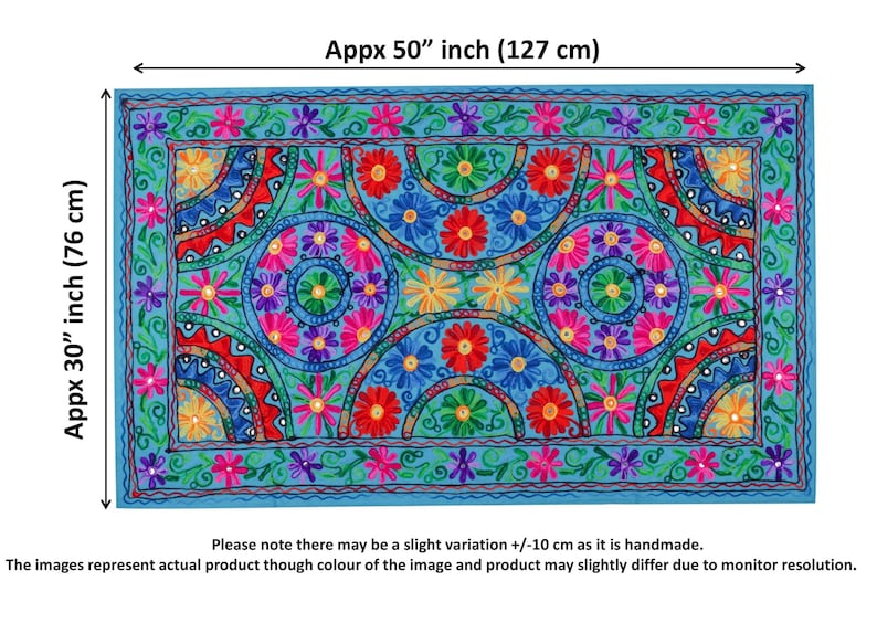 May include: A colorful embroidered wall tapestry with a blue background and a geometric pattern of circles and flowers. The tapestry is approximately 30 inches by 50 inches.