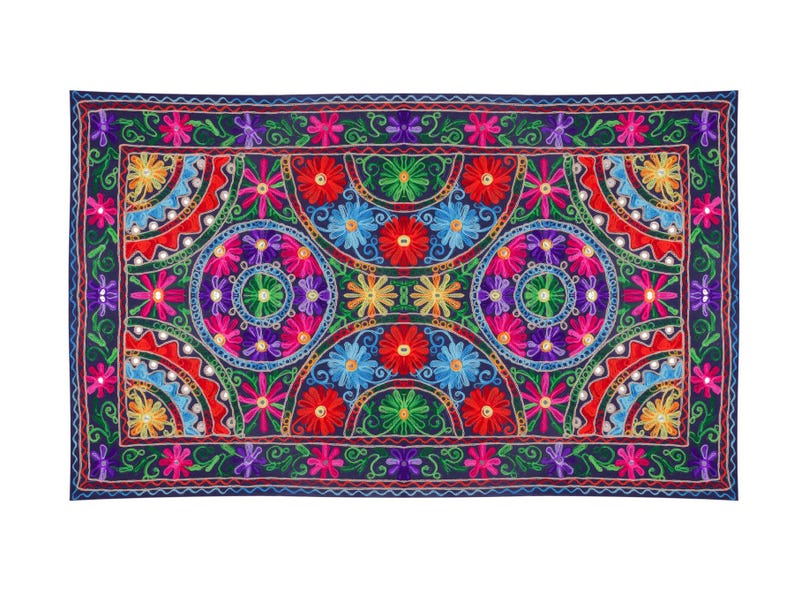 May include: A colorful embroidered tapestry with a repeating pattern of flowers and circles. The tapestry is navy blue with red, pink, yellow, green, and blue embroidery.