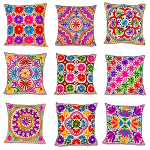 May include: Nine square decorative throw pillows with colorful floral embroidery. Each pillow features a unique design with vibrant hues of red, pink, blue, yellow, and green. The pillows are arranged in a three-by-three grid.