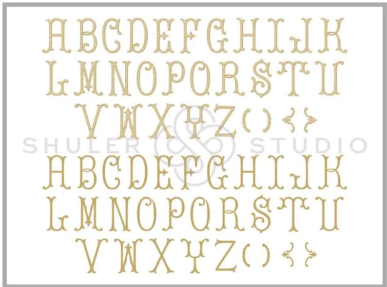 May include: A set of uppercase letters in a decorative font, with a flourish at the top and bottom of each letter. The letters are in a gold color and are arranged in two rows. The letters are A through Z, followed by parentheses and curly braces.