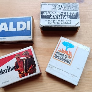 Set van 4 vintage luciferdoosjes – Retro reclame verzamelobjecten (sommige met lucifers)