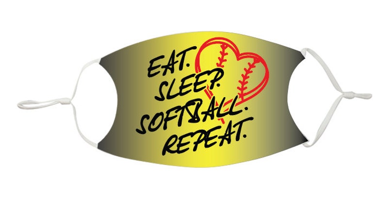 May include: A yellow and black face mask with a red softball in a heart shape. The text on the mask reads "Eat. Sleep. Softball. Repeat."
